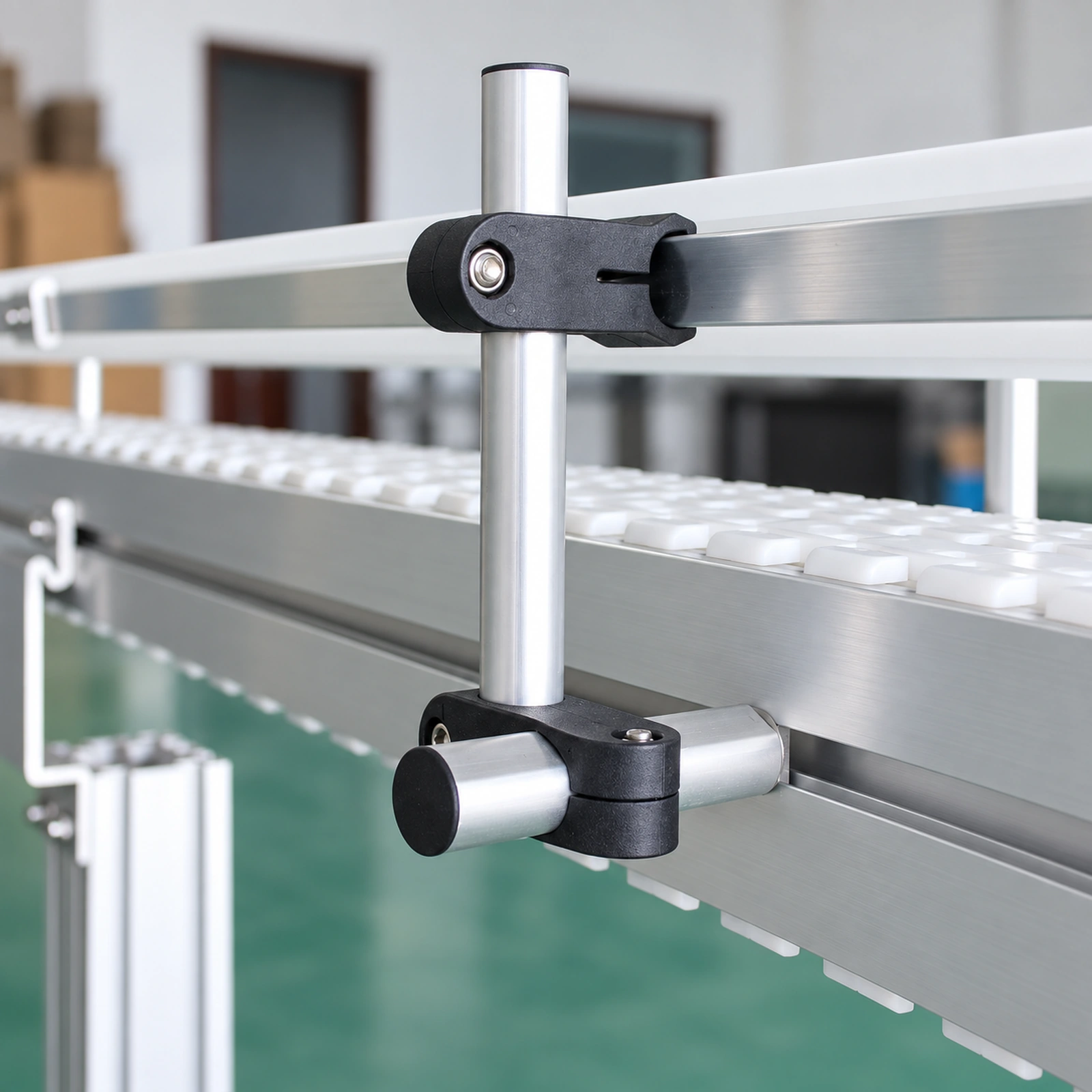 Guide rail clamps and rods beside a conveyor
