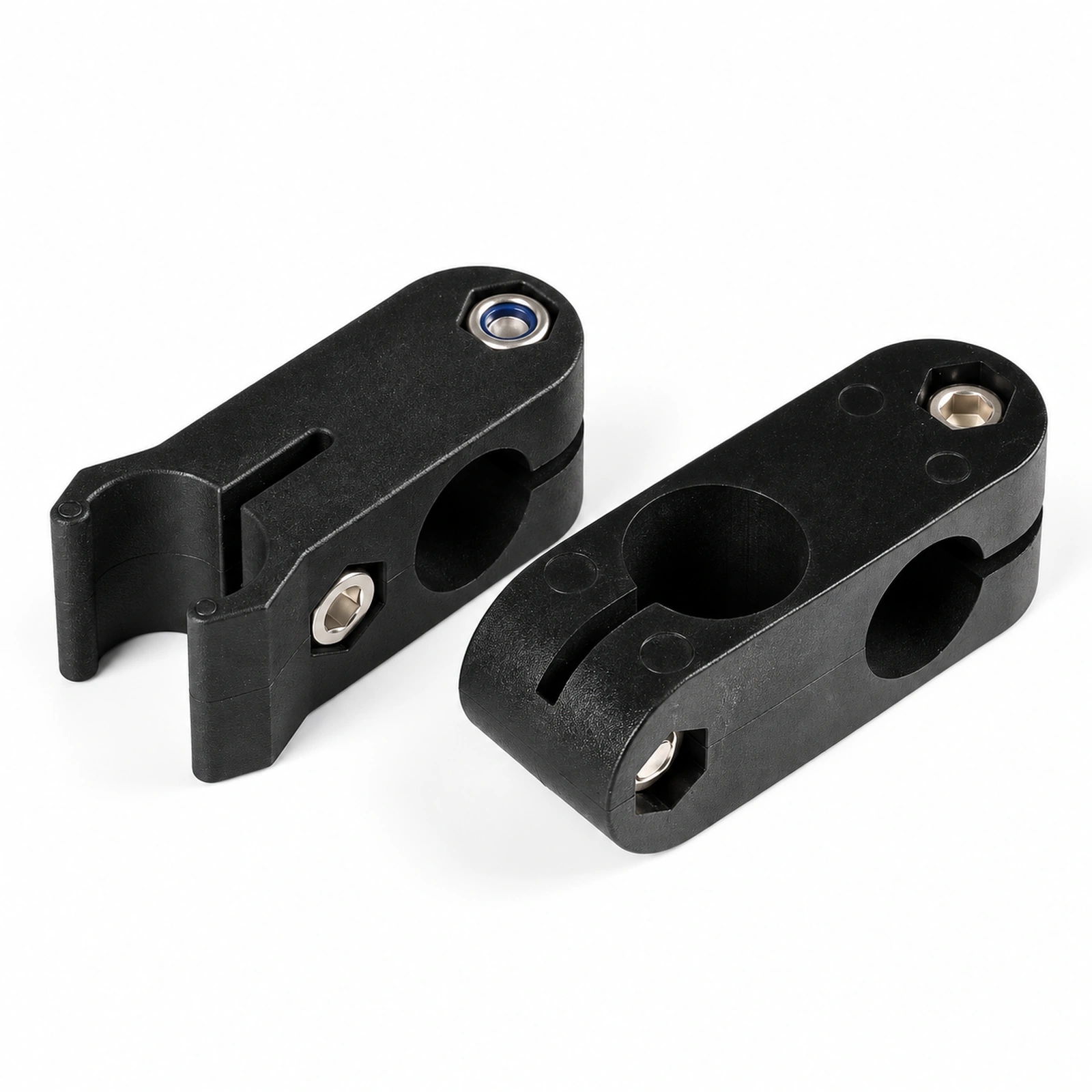 Close view of two black guide rail clamp bodies