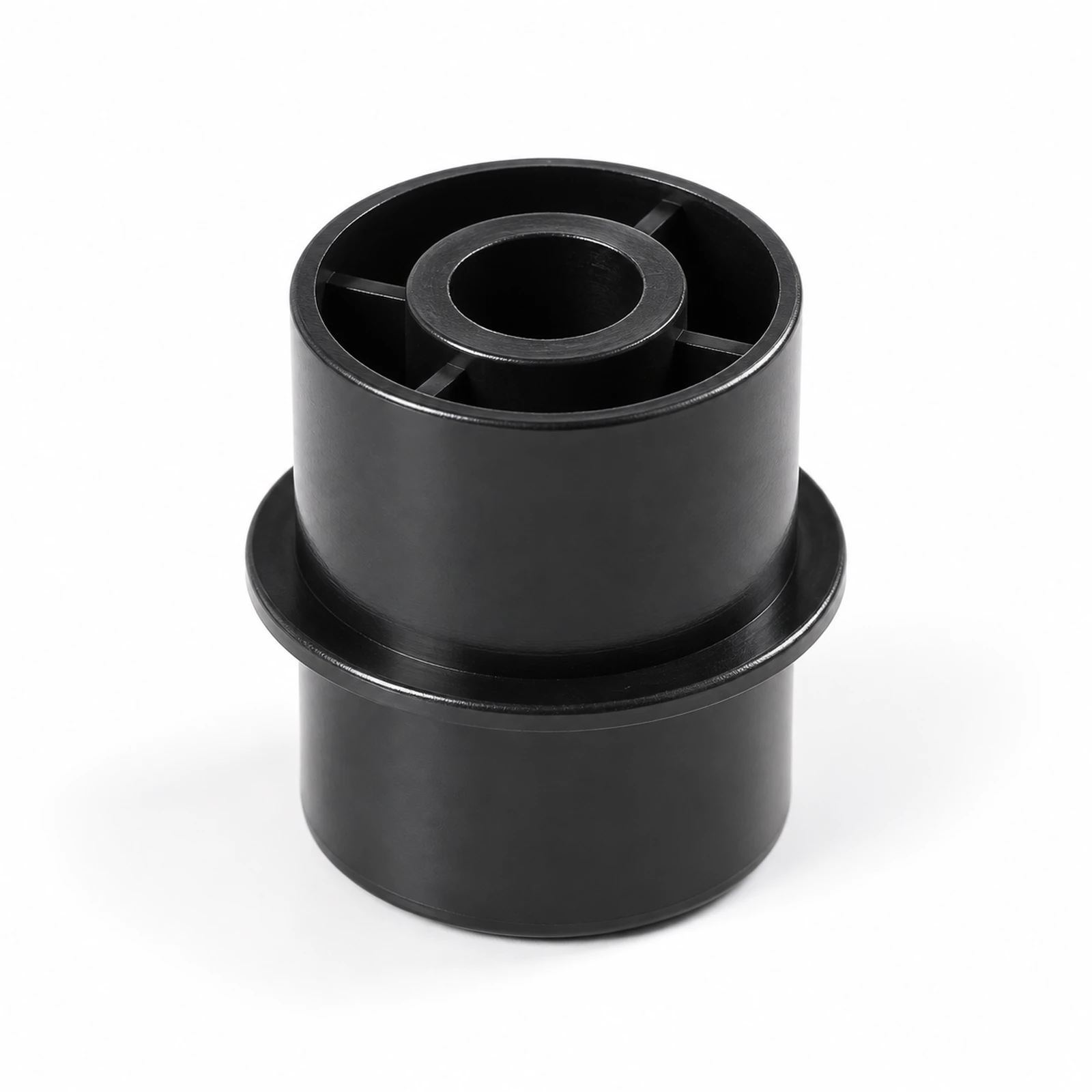 Close view of a black conveyor return wheel with hub and ribs