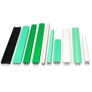 Black, green and white conveyor wear strip profiles on white
